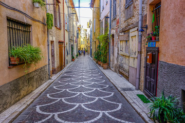 Fototapeta na wymiar 3_ One of the many colourful and quiet streets in Antibes, France.