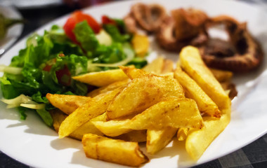 Grilled squid tentacles with french fries.