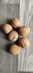 walnuts and hazelnuts on wooden background