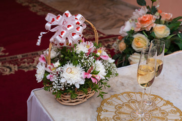 wedding composition. bridal flower bouquet. wedding rings. two glasses with champagne