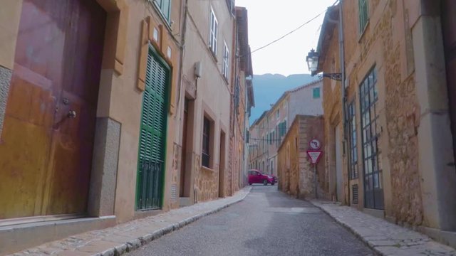 A steady view of an empty street of Sant Llorenç showing traditional Mallorcan village offers visitors impressive architecture as well as many great excursion possibilities and cultural attractions.