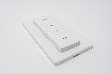 Wireless smart switch to turn on and off light bulbs. Special dimming buttons to increase or decrease light.