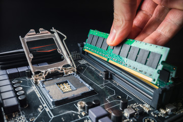 Installing a new RAM DDR memory for a personal computer processor socket in a service. Upgrade repair. PC upgrade or repair concept. - obrazy, fototapety, plakaty