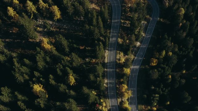 Aerial View landscape serpentine road winding on the mountains background in sunny day.