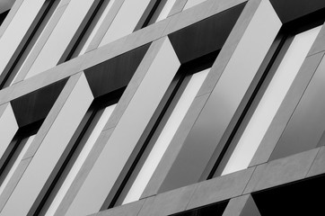 Geometric pattern from part of building facade. Modern architecture of commercial building walls...