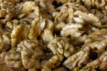 Walnuts kernels closeup, texture of nuts background.