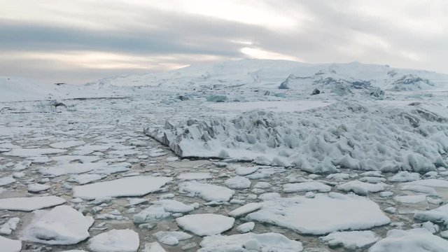 Aerial view of the J kuls rl n glacial lagoon and floating icebergs. The beginning of spring in Iceland