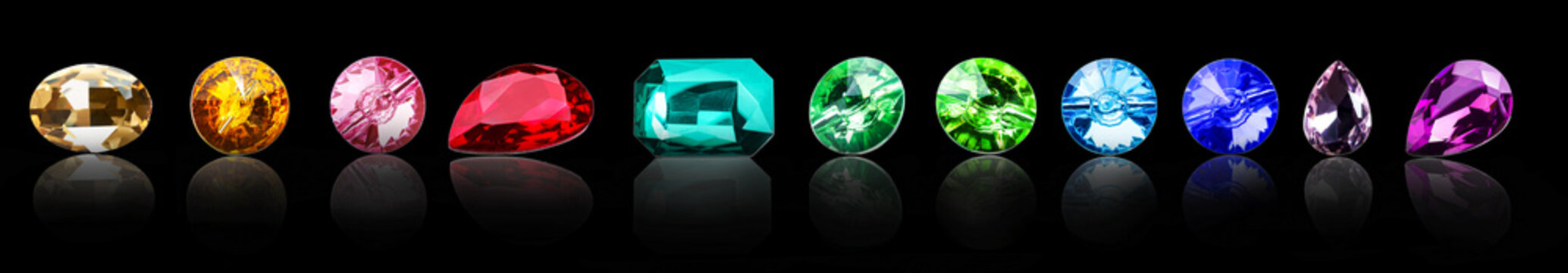 Different precious stones for jewellery on dark background