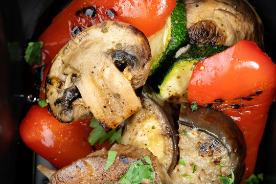 Grilled vegetables with chicken breast, fried champignons, zucchini, peppers.