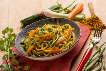 oriental noodles with turmeric spice and vegetables