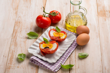 tomatoes filled with eggs and basil