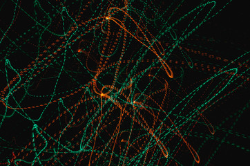Green and orange light trails abstract