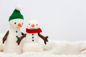 Toy snowman family on white background