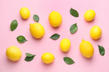 Ripe lemons on color background