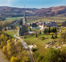 Religious Barsana monastery in Maramures region from the air  in spring season in Sighet - Romania