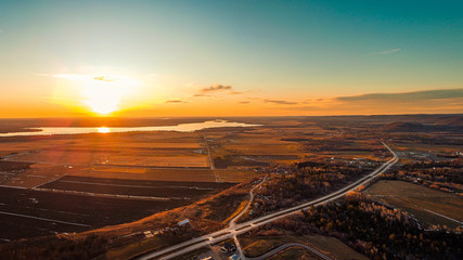Fototapeta premium sunset over luskville and ottawa river city in quebec