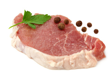 Sliced raw pork meat with parsley and peppercorns isolated on white background. top view