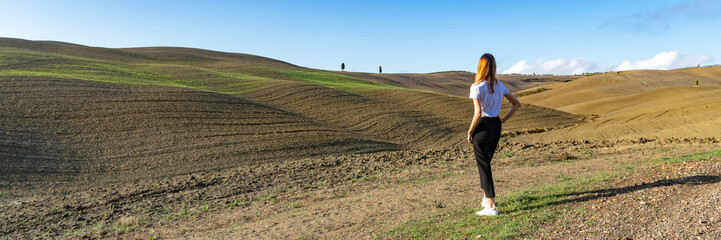 Tuscany landscape at gentle sunset light. Typical for the region tuscan hills. Italy, Europe. Wide banner.