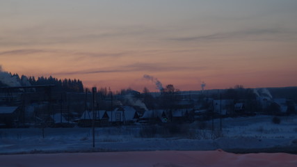 wooden houses against the dawn sky