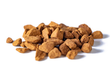 Scattered instant coffee on a white background, energetic drink