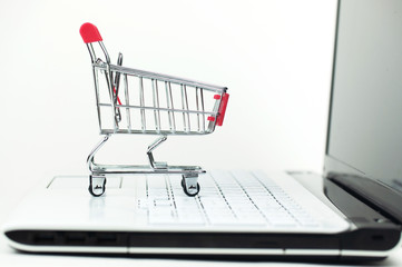 the shopping cart on the laptop keyboard, concept online shopping