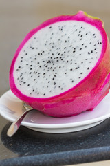 half dragon fruit on the white plate