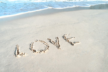 Love on the sea sand beach.