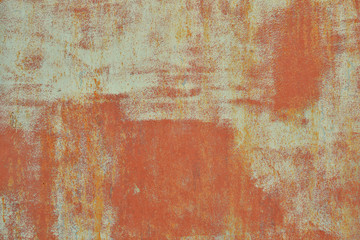 rusty metal wall with traces of old paint