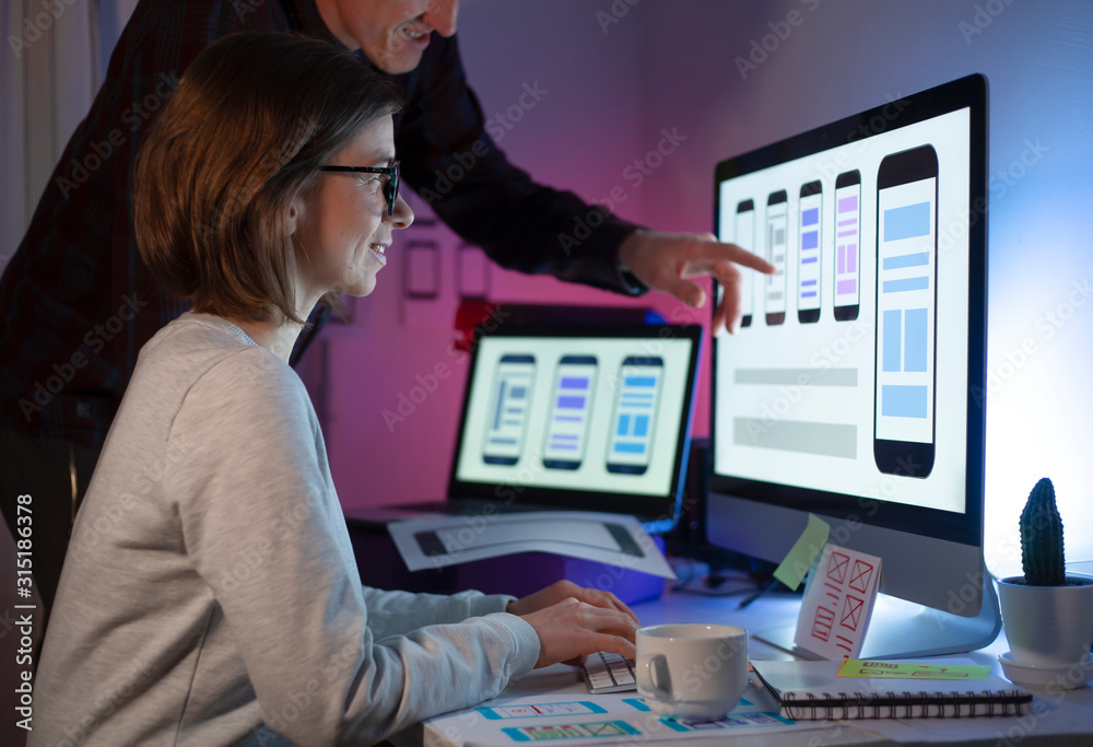 Poster ux designers engineers are developing a mobile phone application interface. user experience.