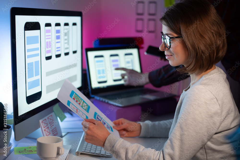 Poster a team of ux designers create an application interface for smartphones. engineers developed user ske