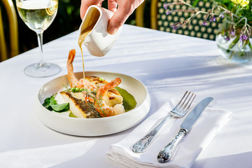 Delicious Seafood , fish with sauce and white wine