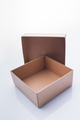 Two-pieces of cardboard box container. Opened empty box isolated.
