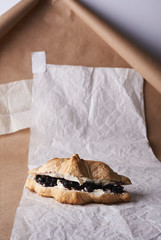 Fototapeta na wymiar croissant with jam and cream cheese