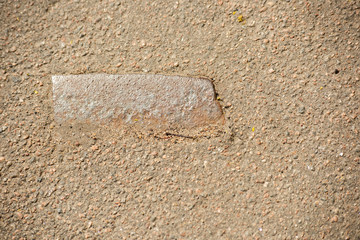 A piece of reinforcement in the asphalt