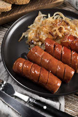 Fried sausage with onion.