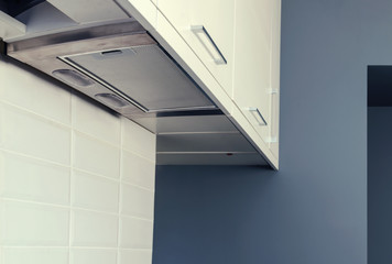 A stainless steel hob on a marble countertop, kitchen set