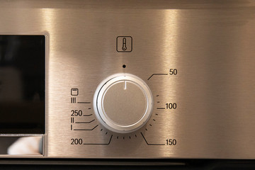 Modern kitchen stove control panel close up