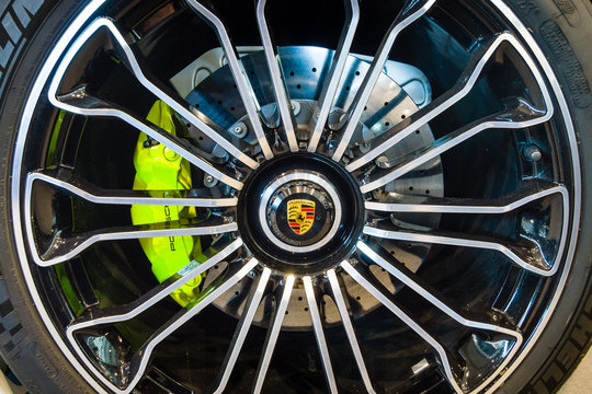 STUTTGART, GERMANY - MARCH 17, 2016: Wheel and brake system of a mid-engined plug-in hybrid sports car Porsche 918 Spyder, 2015. Close-up. Europe's greatest classic car exhibition "RETRO CLASSICS"