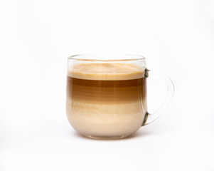 coffee with milk layers, cappuccino in a glass cup on a white background