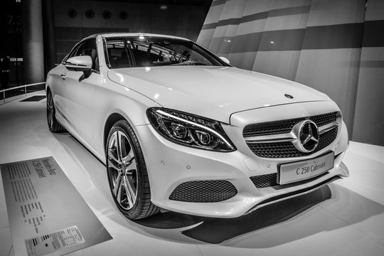 STUTTGART, GERMANY - MARCH 17, 2016: Compact executive car Mercedes-Benz C250 Cabriolet (W205), 2016. Black and white. Europe's greatest classic car exhibition "RETRO CLASSICS"