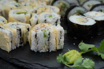 Cucumber and avocado sushi rolled in seaweed and yuba skins
