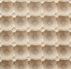 volumetric texture of a beige paper egg tray, full frame