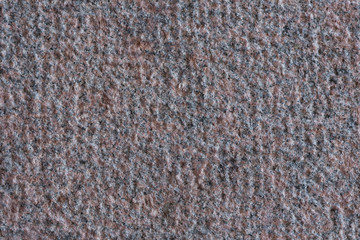 Roughly processed granite slab. Top view. Backgrounds and textures. Close up