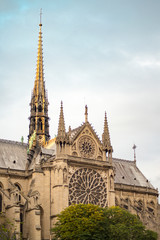 Fototapeta na wymiar Gorgeous sunset over Notre Dame cathedral with puffy clouds, Paris, France.Notre Dame de Paris - Gothic Catholic Cathedral with rose window and gargoyle sculptural decorations at 2016.