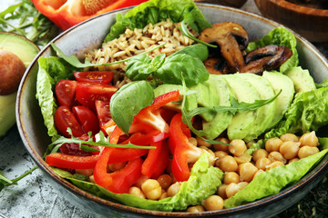 Quinoa and spicy chickpea vegetable vegetarian buddha bowl. Healthy food concept with tomato