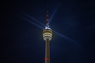 Stuttgart Television Tower (Fernsehturm) against night sky with stars and light beams, Germany © Timo Günthner