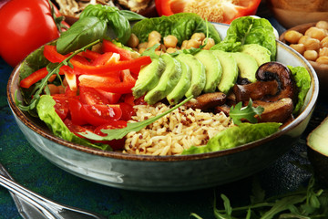 Quinoa and spicy chickpea vegetable vegetarian buddha bowl. Healthy food concept with tomato