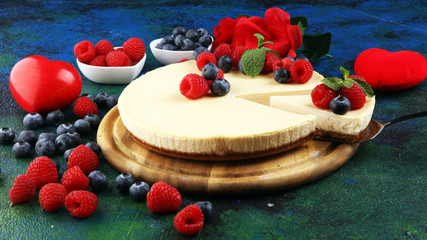 Homemade cheesecake with fresh raspberries and mint for valentines day - healthy organic summer dessert pie cheesecake. Vanilla Cheese Cake for dessert