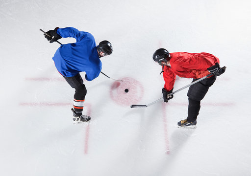 Hockey opponents in opening face off
