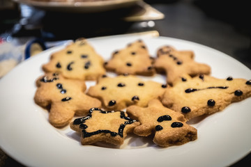 Christmas shortbread cookies in the shape of fir trees, stars and snowmen